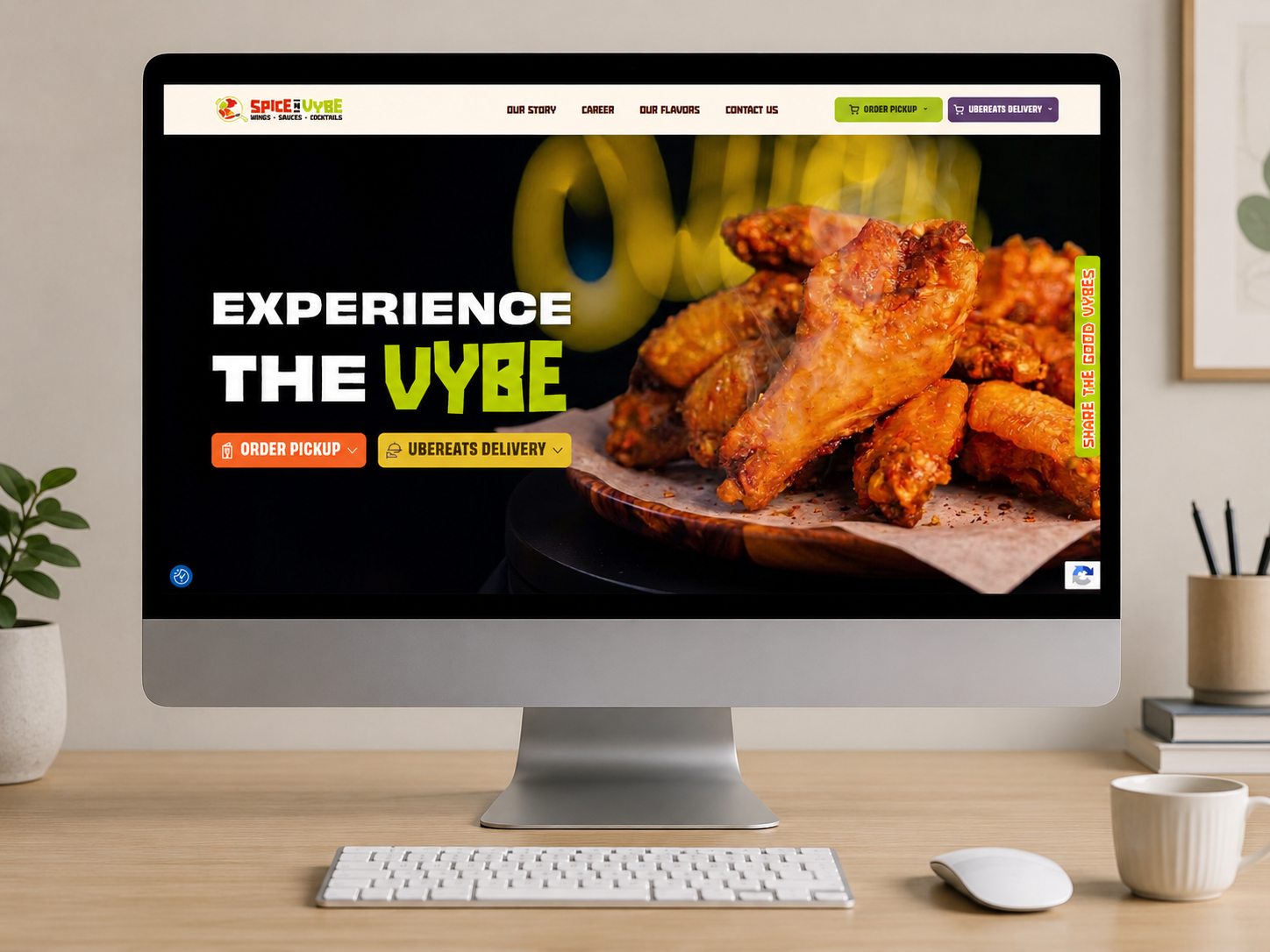 Hero banner on a restaurant website showing crispy chicken wings and the words 'EXPERIENCE THE VYBE' with orange and yellow order buttons.