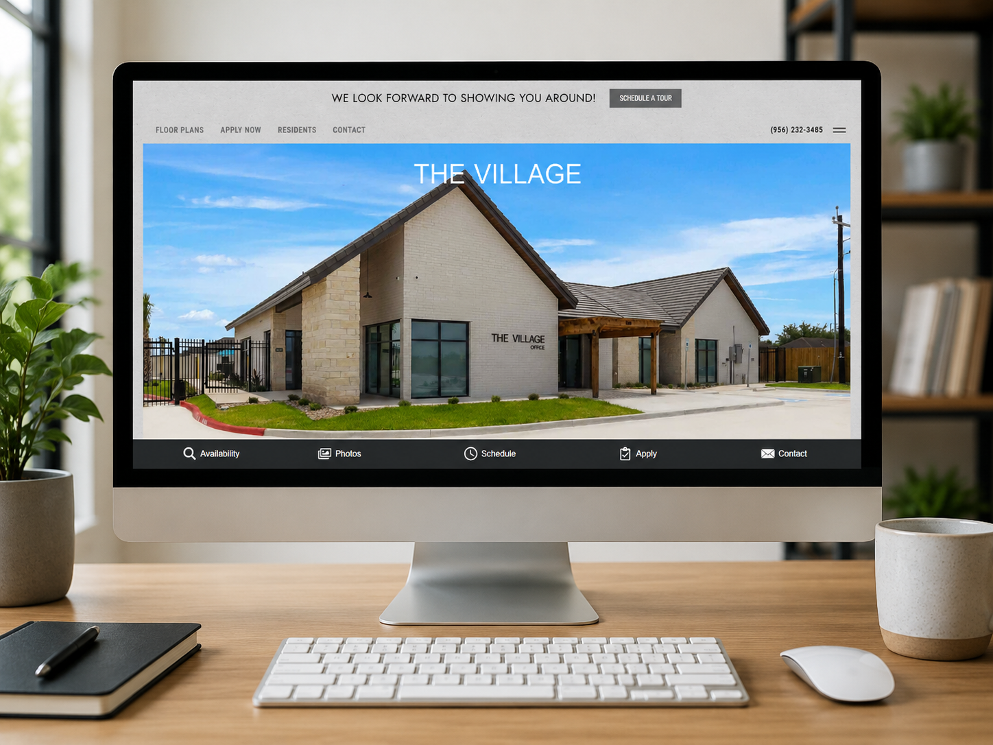 Webpage hero image showing the exterior of The Village office building on a real estate site.
