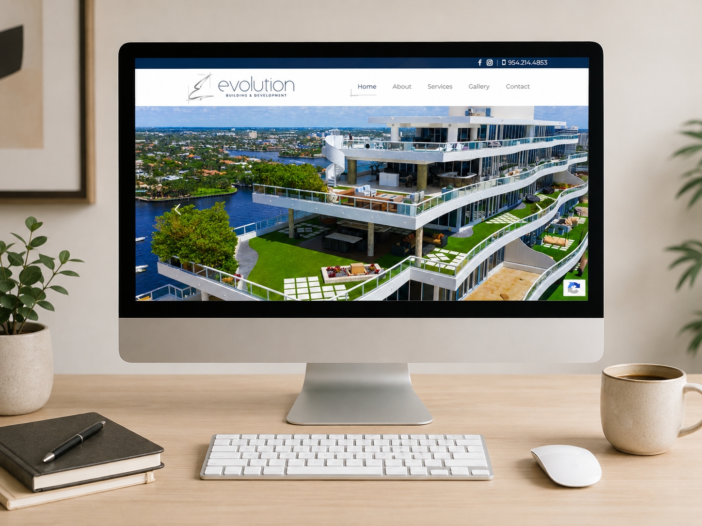 Monitor showing a modern, multi-level waterfront building on a real estate website called Evolution Building & Development.