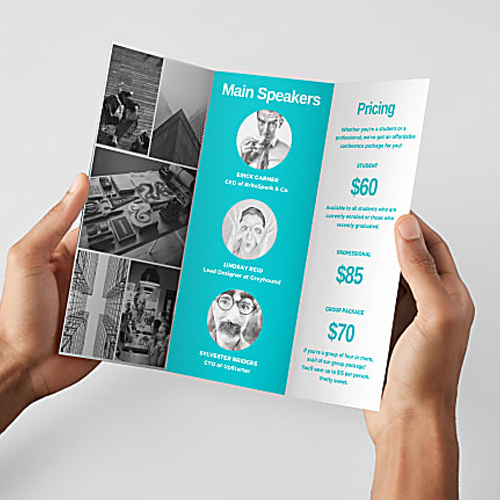 Two hands hold a tri-fold brochure with a blue 'Main Speakers' panel and a right pricing column showing $60, $85, and $70.
