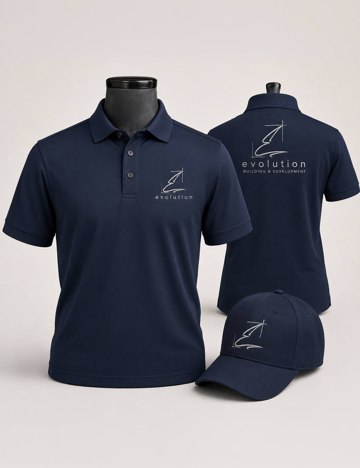 Navy polo shirt with a white evolution logo on the left chest and a matching back logo, plus a navy cap in the foreground.