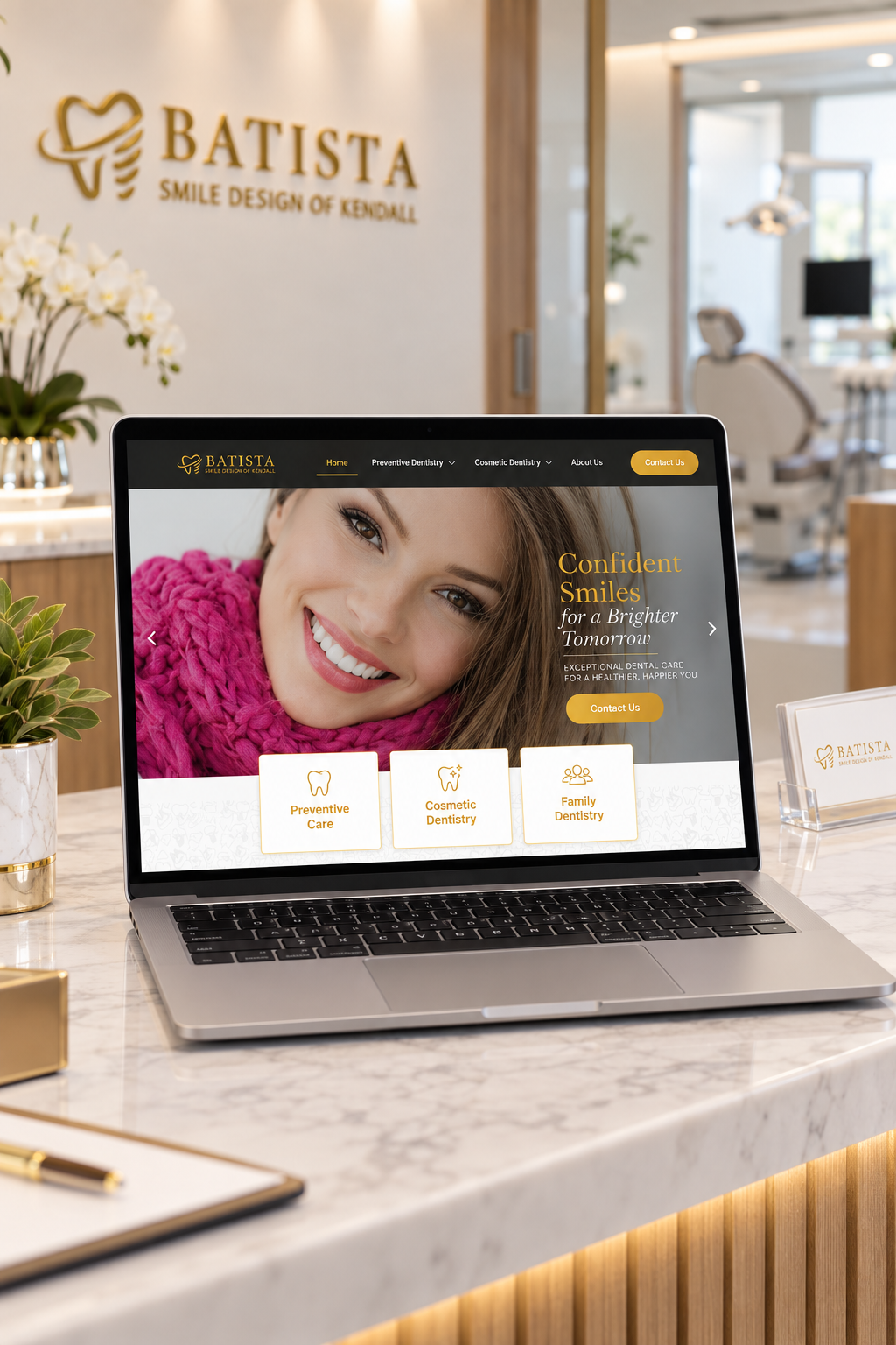 Laptop on a marble counter displaying a dental clinic website with a smiling woman on the hero image, reception area in background.